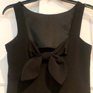Black sleeveless cocktail sheath dress